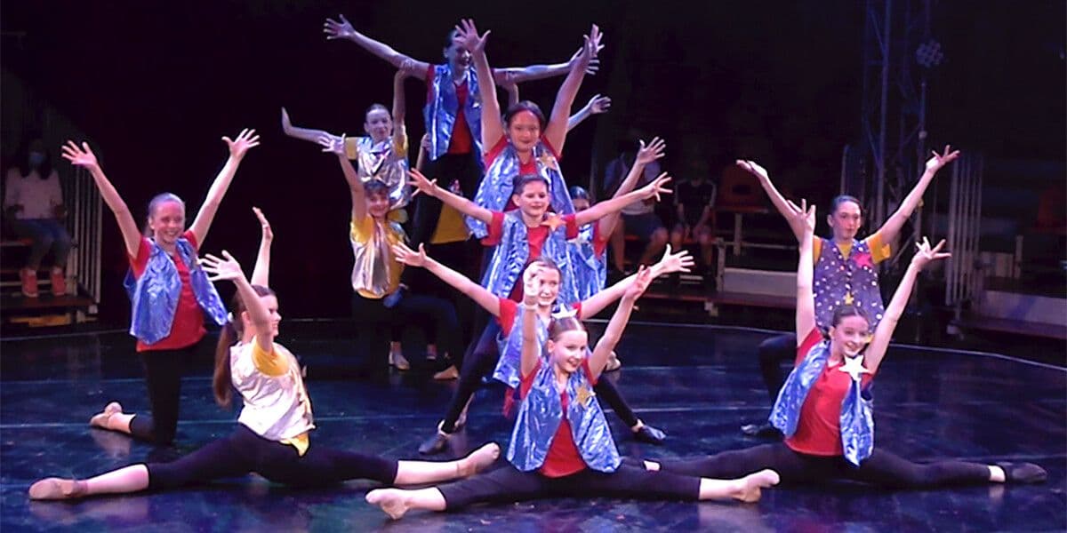 Image of a group of students in a dance pose.